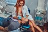 94100768-a-hot-redhead-dentist-woman-taking-care-of-her-patient.jpg