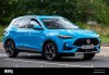 milton-keynesuk-july-19th-2023-2023-blue-mg-hs-trophy-s-a-travelling-on-an-english-road-2RD71F5.jpg