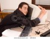 stock-photo-businessman-in-his-office-cuddle-computer-and-sleeping-at-working-place-3893200.jpg